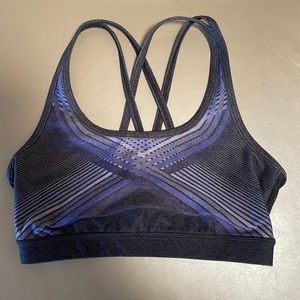 With grey and purple criss cross back sports bra size small
